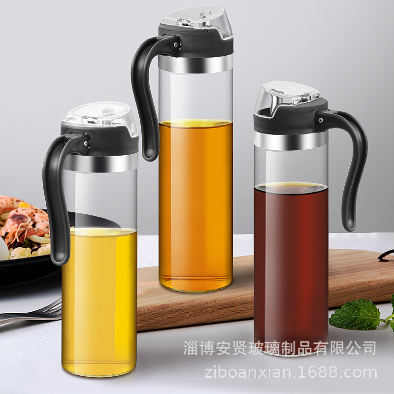 Apertura y cierre automático del engrasador de vidrio boquilla de aceite de acero inoxidable botella de aceite de inducción por gravedad botella de condimento de frasco de aceite doméstico de vidrio