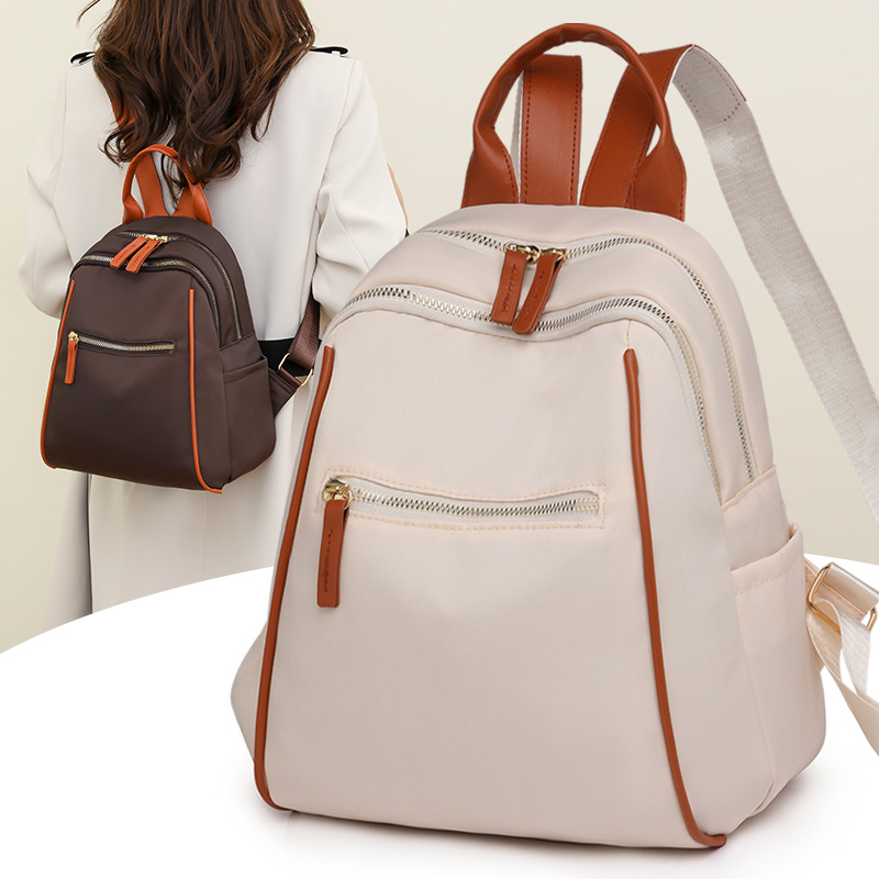 Mochila portátil para mujer 2024 nuevo estilo nylon fuera de viaje mochila simple bolsa de escuela de estudiante de gran capacidad al por mayor
