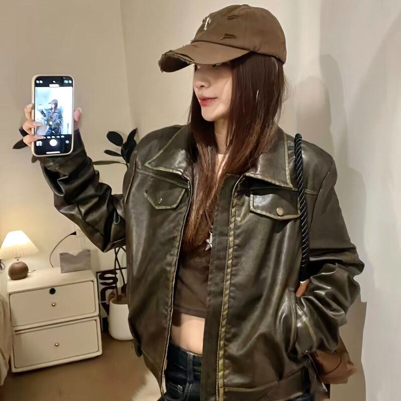 American retro style brown short leather jacket for women with zipper and turn-down collar, featuring a Maillard design and biker style American retro style brown short leather jacket for women with zipper and turn-down collar, featuring a Maillard design and biker style