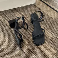 White summer sandals with a strap, suitable with a skirt