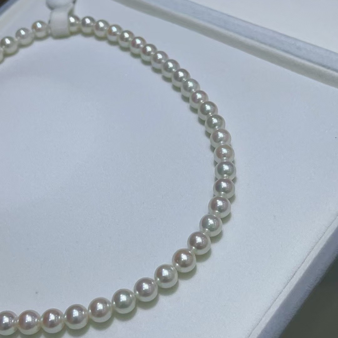 海水akoya珠串黄金点位7-7.5mm正圆几乎无暇冷白带一点粉色伴彩