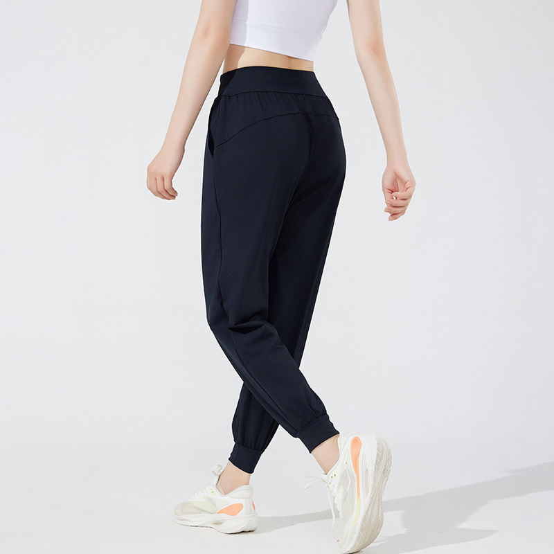 Pantalones deportivos casuales elásticos y transpirables estilo otoño 2026 para mujer, ideales para yoga, correr y fitness al aire libre.