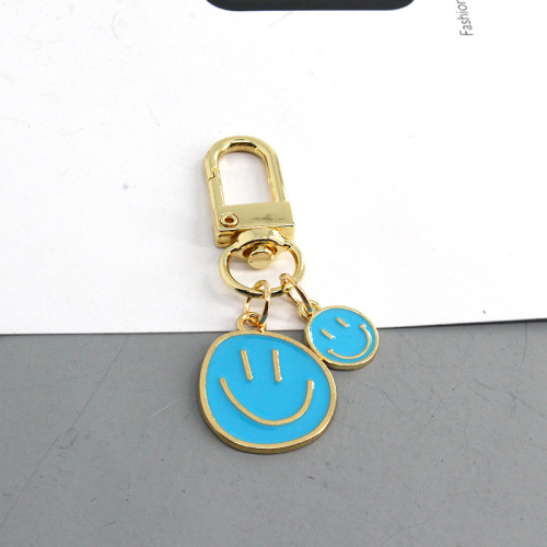 European and American cross-border new cartoon smiley face keychain fashion dripping oil color large and small smiley face pendant girl heart pendant