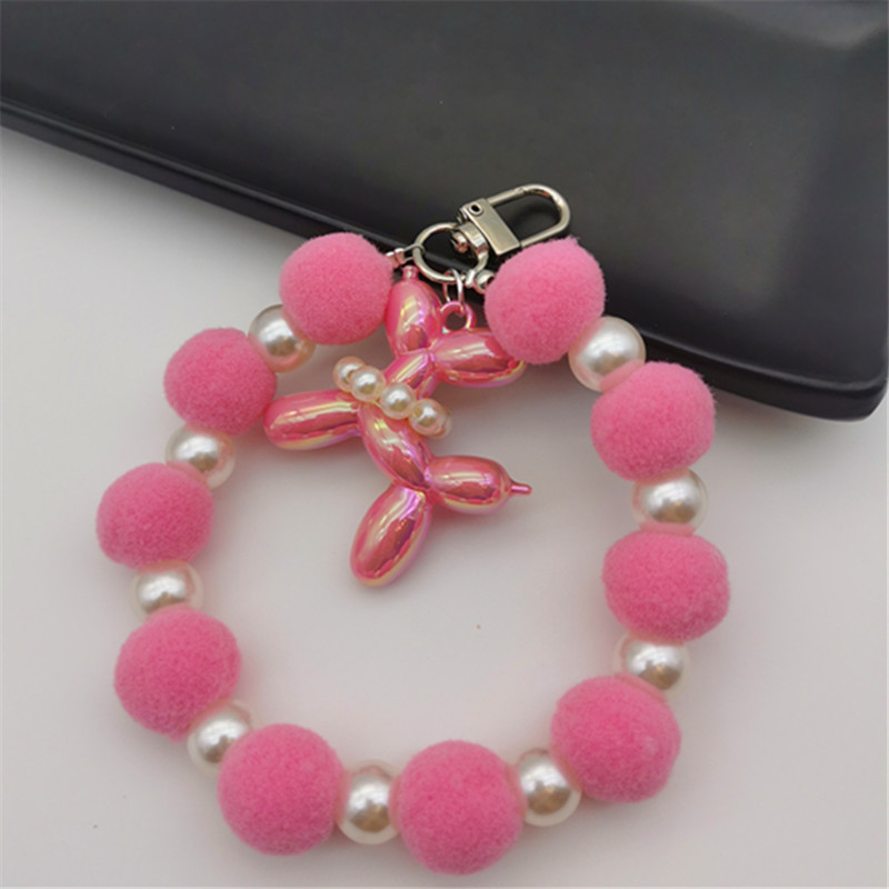 Nueva bola de piel de cadena de perlas colgante cadena de teléfono móvil ins Internet celebridad mismo estilo muñeca de invierno pulsera peluda cadena portátil