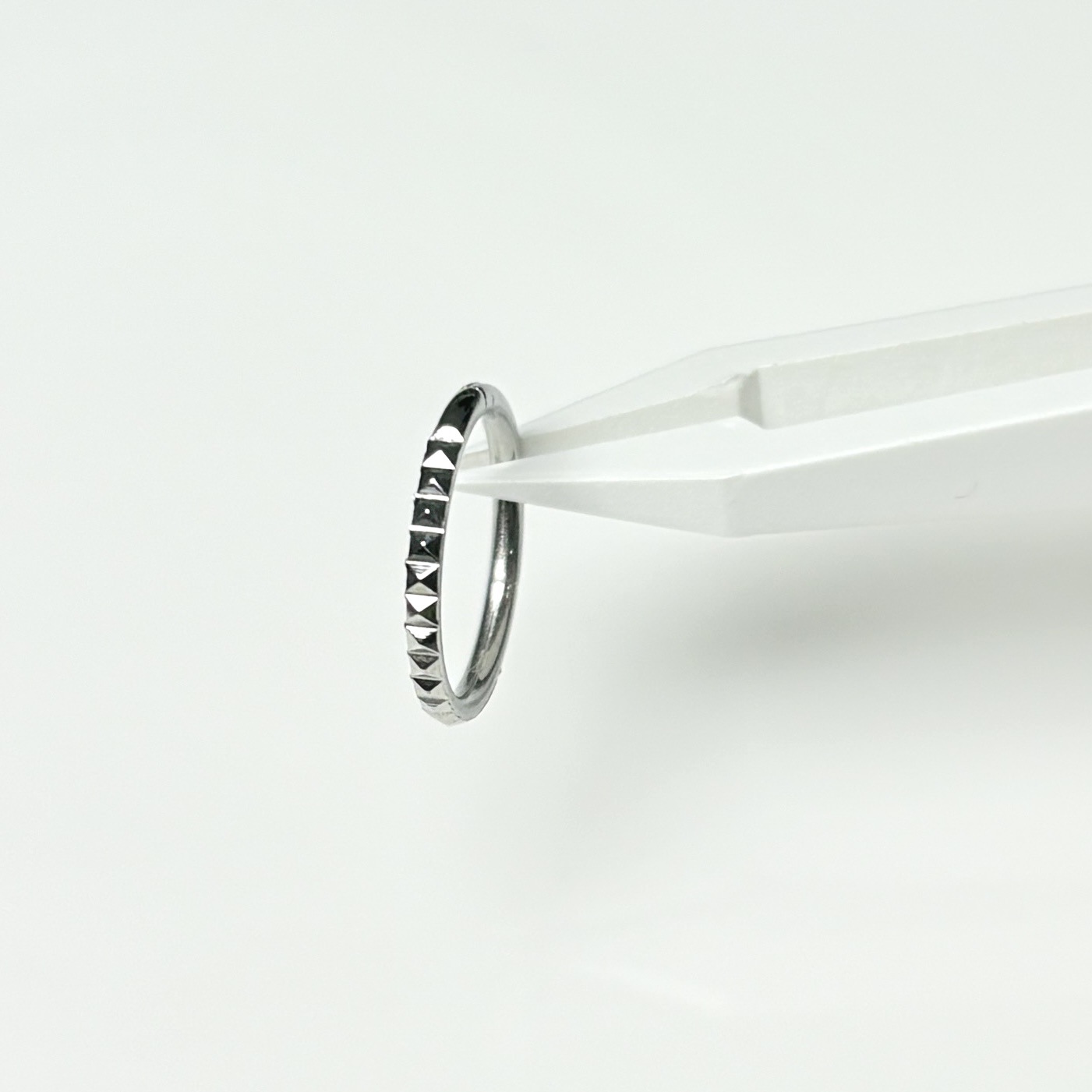 Pointed labret stud close-up product detail