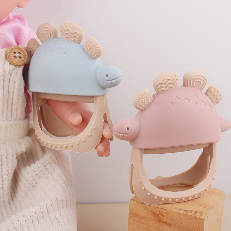 Nuevos guantes de mordedor de dinosaurio de silicona anti-comer para bebés