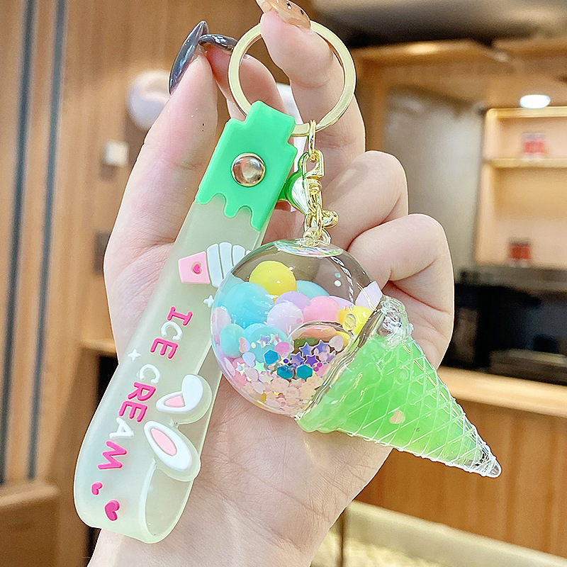 Arenas flotantes transfronterizas coloridas frijoles botellas flotantes de helado llaveras de chicas bolsos colgantes de arena flotante pequeña decoración colgante para mujeres