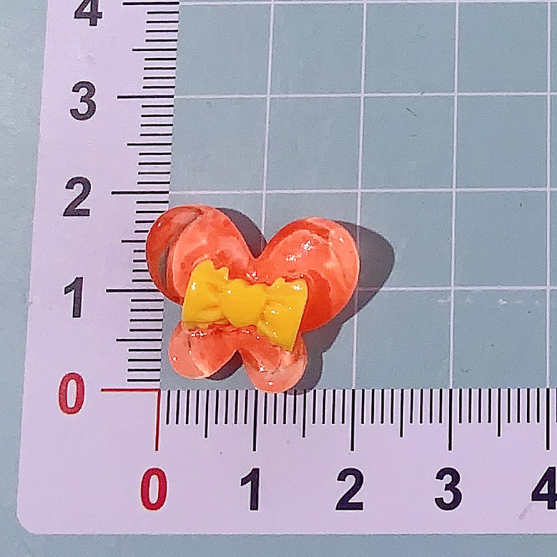 Nuevo color transparente mariposa arco DIY accesorios de resina pegamento crema caja de teléfono móvil adornamiento de pelo agujero material de parche de zapatos agujero