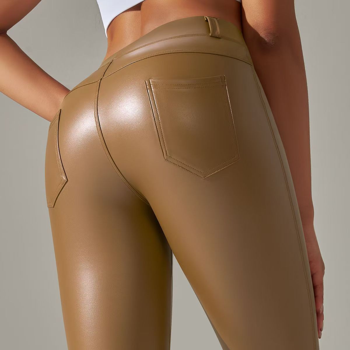 2024 Europa y América Pantalones de cuero PU mujeres de cintura alta ajustados pantalones de bolsillo molido leggings nuevo otoño invierno