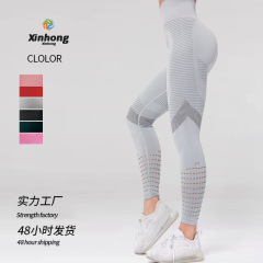 アマゾンの新型の透かし彫りのヨガのズボンのレジャーのフィットネスの腰の高いスポーツのズボンのガードルはやせていて通気性のヨガの服の卸売りを現します。
