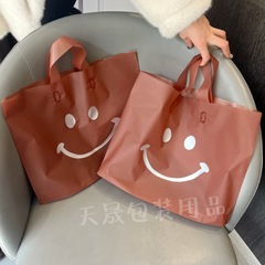Matte cartoon smile clothing bag wholesale plastic hand-held gift shopping children's clothing store packaging