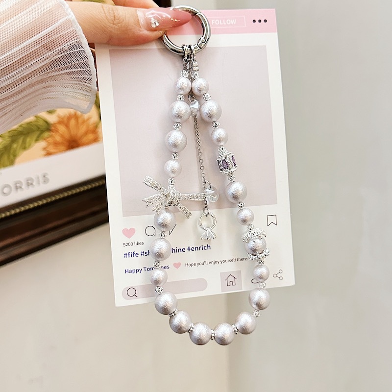 Boutique hecho a mano de alta gama cadena de teléfono móvil cadena de pulsera de perlas de tres colores cordón de teléfono móvil de moda colgante de mensajero largo