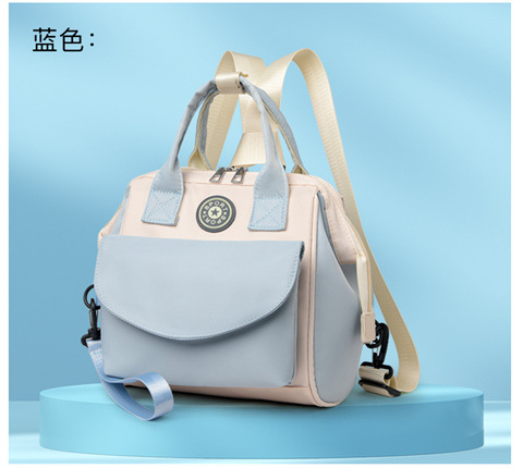The Mommy bag is small and cute. It has a detachable front pocket and is a multi-functional baby bag. It is waterproof, lightweight, and has a crossbody design. It can be used to carry milk bags undefined