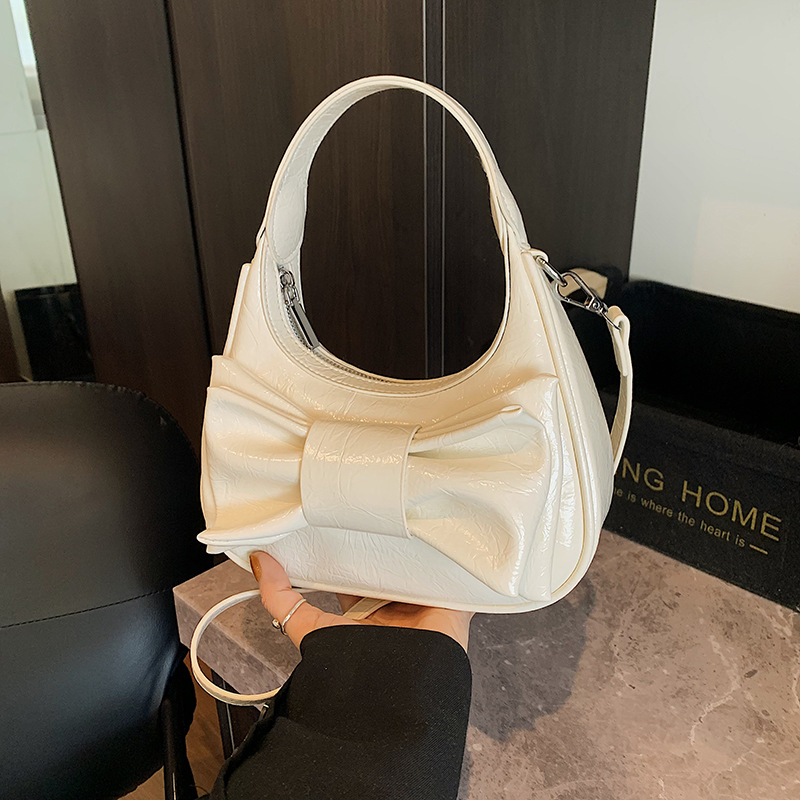 Bolso de moda coreano 2025 verano nuevo bolso femenino de alta calidad textura bolso de hombro lindo lazo bolso de mensajero