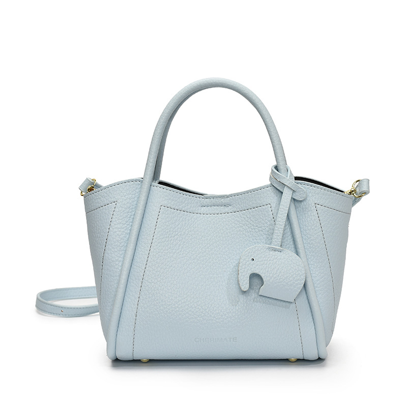 Tendencia transfronteriza de moda canasta de platos de mano 2025 nuevo nicho de alta sensación bolso de hombro bolso de cubo universal para mujeres