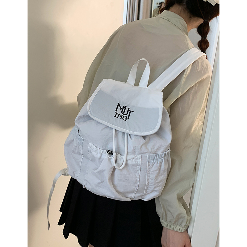 カジュアルナイロンキャンバスバックパック女性の 2025 新しいファッションレターバックパックカレッジスタイル大容量スクールバッグ|undefined