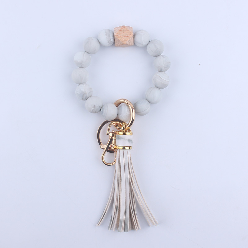 Nuevo cuero de LA PU corto Borla Llavero DIY de silicona de impresión de leopardo de color sólido con cuentas muñeca llavero colgante