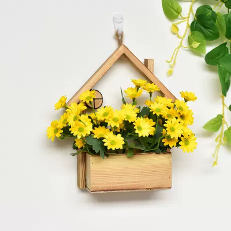 Wooden house + yellow daisy