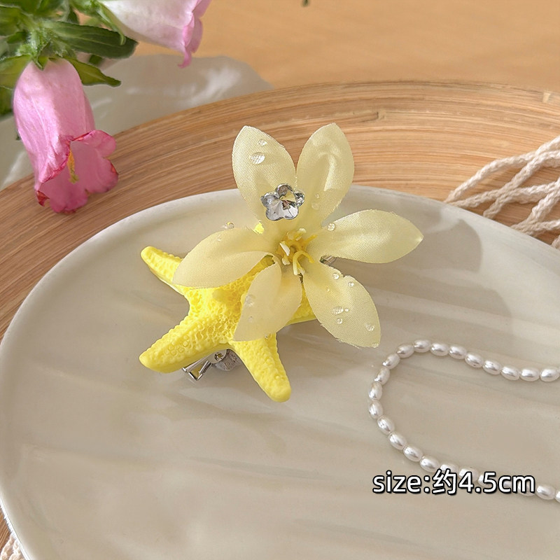 Horquilla amarilla con forma de flor de estrella de mar y pedrería, diseño limón #6, de aproximadamente 5.5 cm.