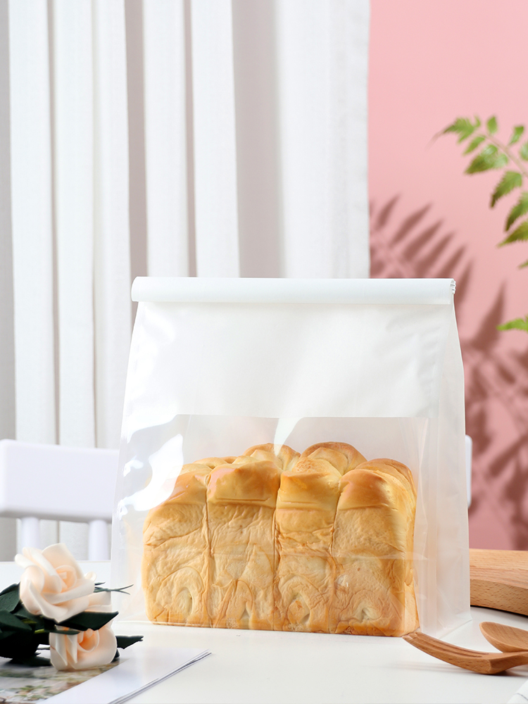 Bolsas de tostadas, bordes de alambre de hierro, sellado, pan rebanado, leche, dátiles, crispado de nieve, horneado transparente, punto oeste