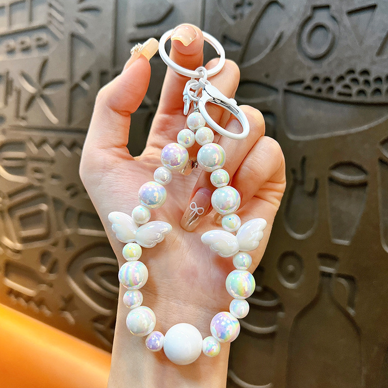 Sala de transmisión directa con alas recuerdos llaveros lindos colgantes de teléfonos móviles accesorios de bolsos llaveros de automóviles al por mayor