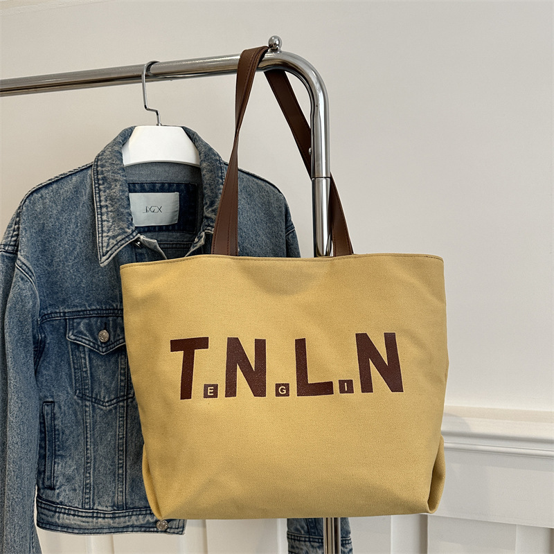 Bolsa de lona de gran capacidad para mujeres 2025, primavera y otoño, nueva literatura y moda, bolso de hombro, letras casuales, bolso de viaje