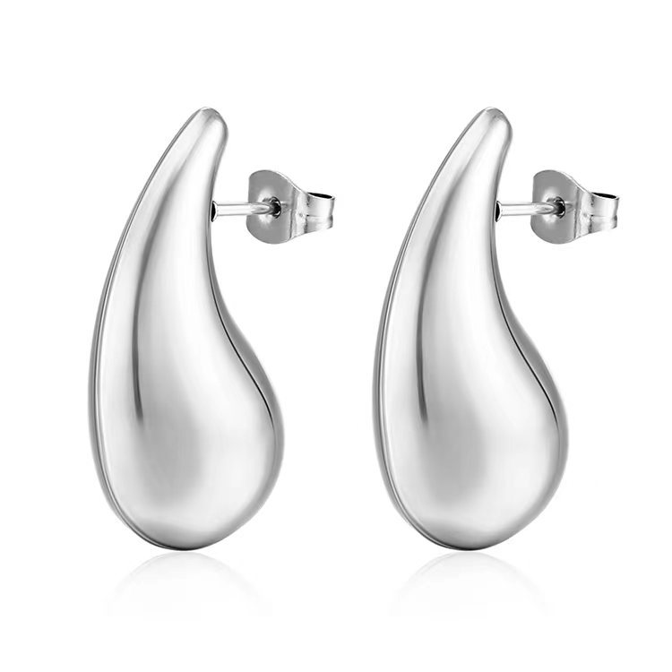 Aretes huecos de acero inoxidable de moda transfronteriza lujoso ligero temperamento femenino simple aretes de acero de titanio simple personalidad auriculares