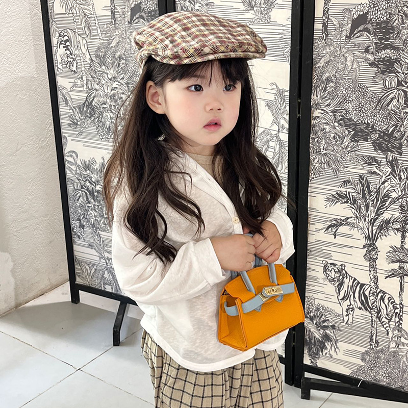 Bolso de hombro estilo coreano para niñas, elegante mini bolso cruzado de color liso para niños, nueva colección otoño 2025, bolso infantil de comercio exterior.