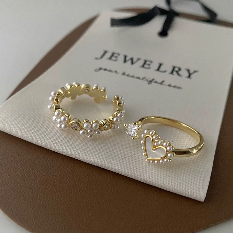 Small design retro universal ring from pearl, flowered, simple and elegant design, on index finger