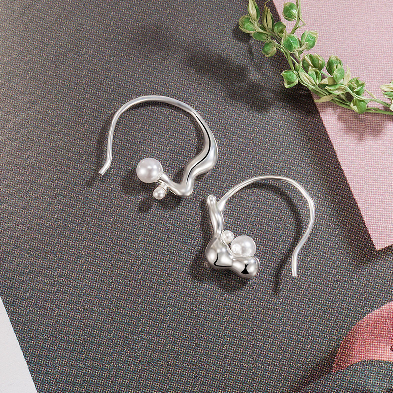 Asymmetrical small design geometric earrings from pearl