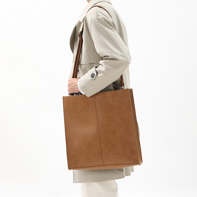 Korean version of fashionable PU leather shoulder bag, simple commuter men's and women's tote bag, square vertical crossbody large-capacity handbag_voghion.com