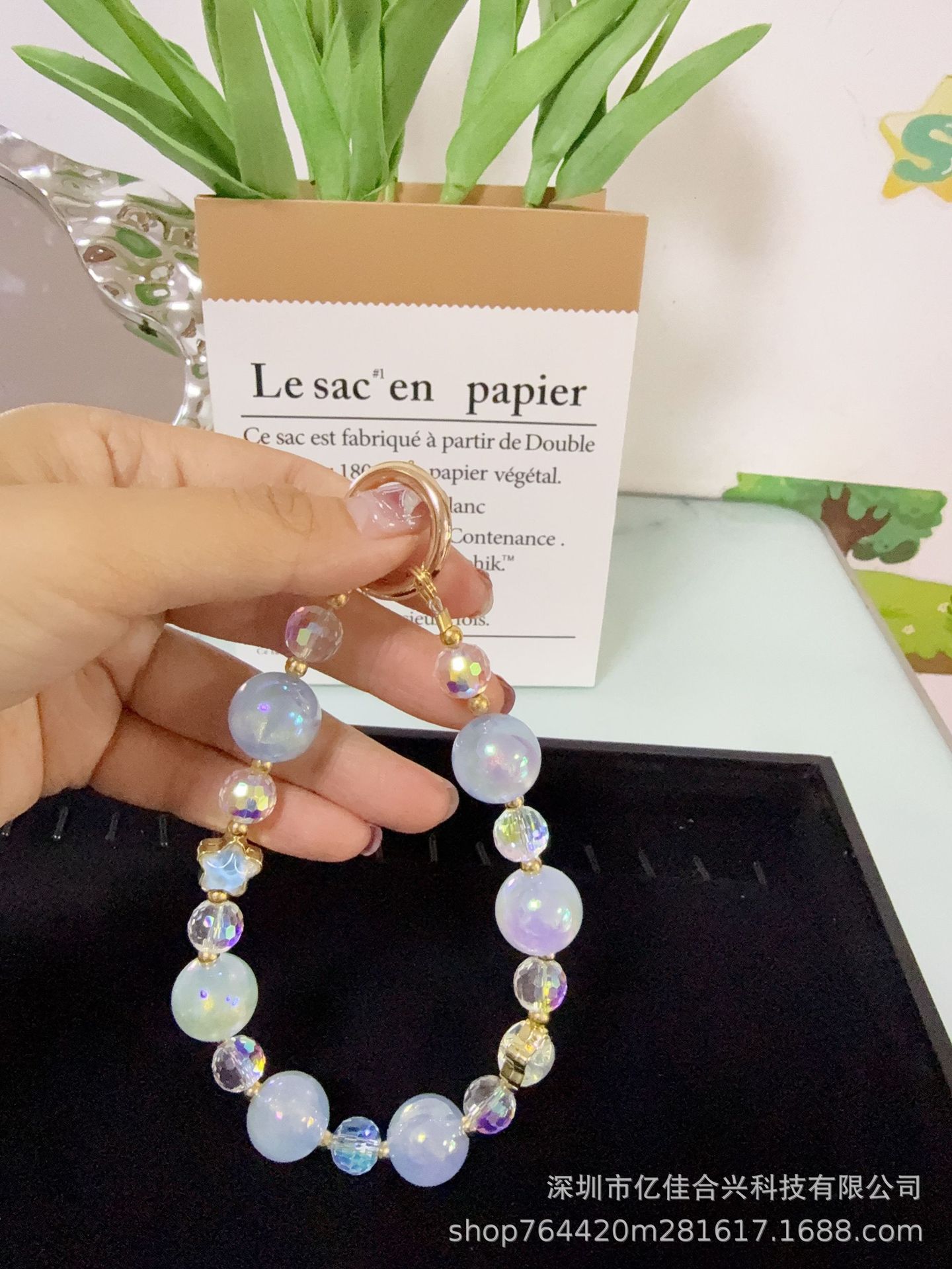 Mayorista cadena de teléfonos móviles sensación de alta calidad estereoscópica bola pentagonal llave colgante perla de teléfono móvil colgante pulsera nuevo