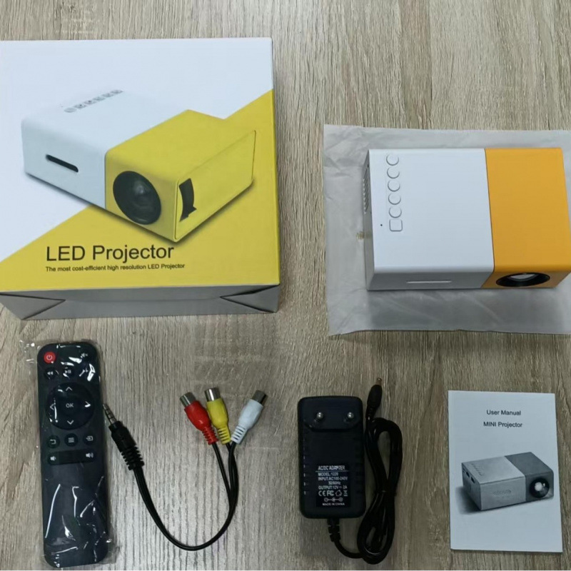 Popular Yellow and White Projector Yg300 with Mobile Phone Same-Screen Home Entertainment Mini Micro Portable Projector
