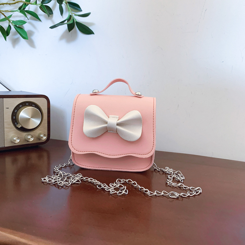 Lindo bowknot girl cadena bandolera moda color sólido bolso de bebé estilo occidental mini bolso de accesorios para niños