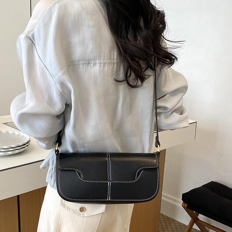 Nicho de diseño bolso de palo para mujeres 2026 nuevo estilo simple versátil bolso de hombro textura ligera de lujo bolso de mochila de moda bolso pequeño