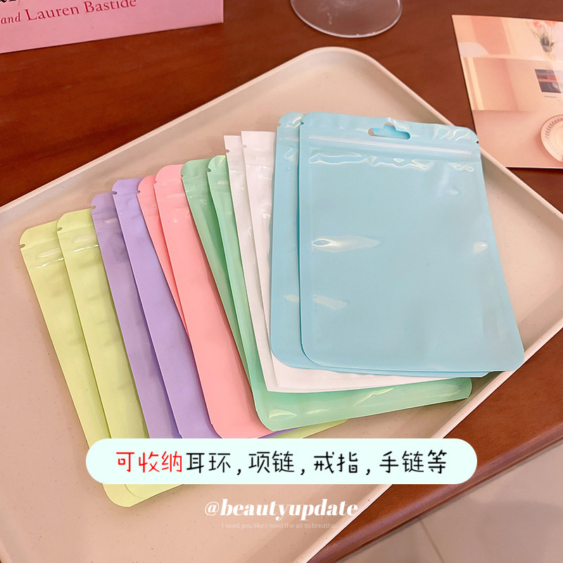 Macaron color bolsa de autosellado bolsa de plástico engrosada transparente color hueso bolsa de almacenamiento sellado bolsillo maquillaje cepillo bolsa de embalaje