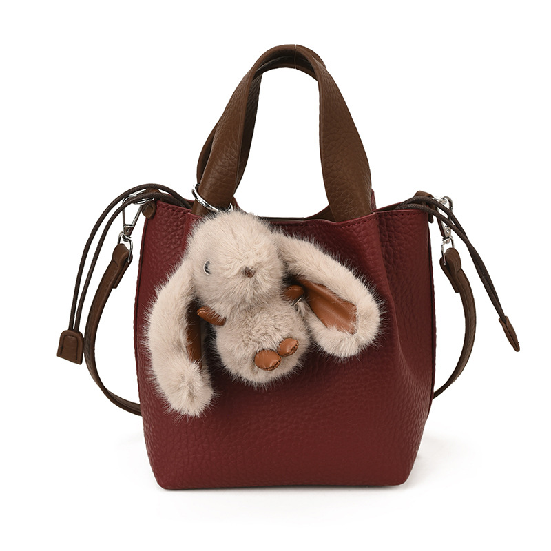 Bolso de mano retro de alto nivel, bolso de balde de agua universal para mujeres 2025, nuevo estilo coreano de invierno para niños y madres, bolso de hombro.