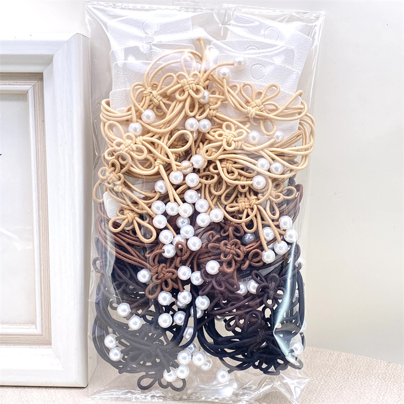 Nueva cinta para el pelo estilo coreano con lazo y cuentas en color té con leche, bandas para el pelo de colores primaverales para tiendas físicas, supermercados y venta al por mayor en tiendas de 2 yuanes.