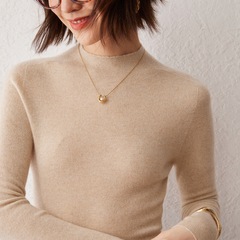 100純カシミヤのニットの半高襟の女性は秋冬の新型の中に身を修める上着を着ます。