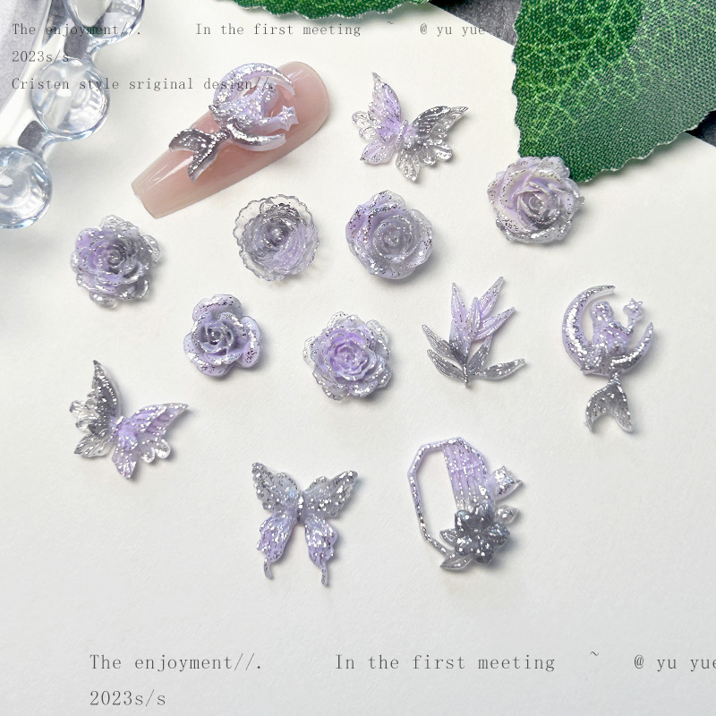 Nueva joyería de uñas de estilo gris-púrpura salvaje de estilo ins mezclada luminosa tridimensional de flores pequeñas accesorios de armadura al por mayor