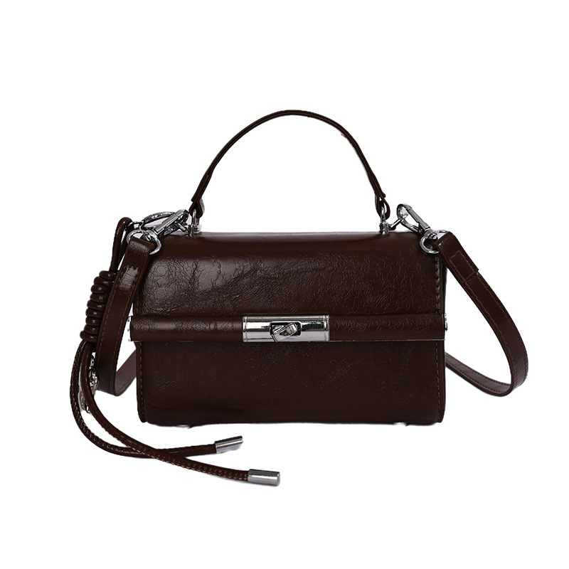 Bolsa de mano transfronteriza para mujeres 2026 nuevo bolso de hombro de verano de alta calidad retro bolso de mano de moda mochila