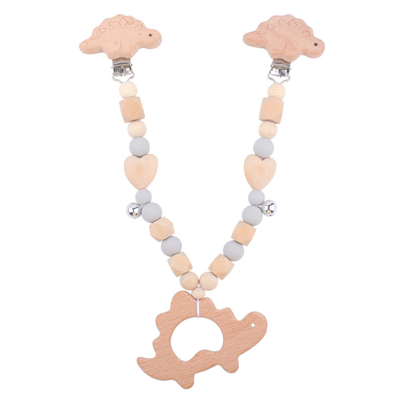 Suministros para bebés pulsera de silicona molar de juguete para niños Cadena de cochecito de dinosaurio de tres piezas creativa pequeña campana colgante