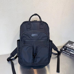 カジュアルなランドセルの新型の太いナイロンのリュックサックの多いポケットは簡単で実用的です。