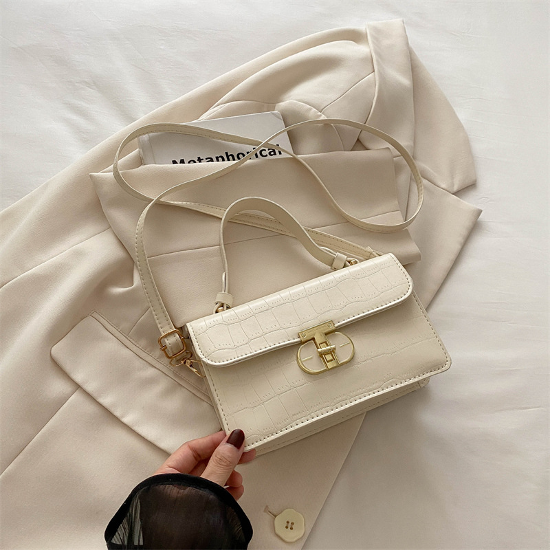 Este año, la popularidad de la bolsa de nicho de mujeres, la caja de bolsas 2024, el nuevo bolso pequeño, simple bolso de hombro con patrón de piedra, bolso cuadrado