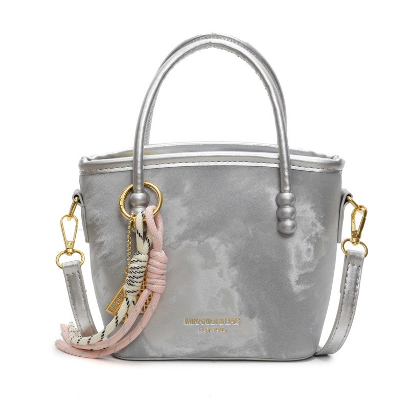 Comercio exterior venta caliente bolso de cubo de mano damas 2025 nuevo estilo de tendencia universal bolso de hombro de alta calidad bolso de moda