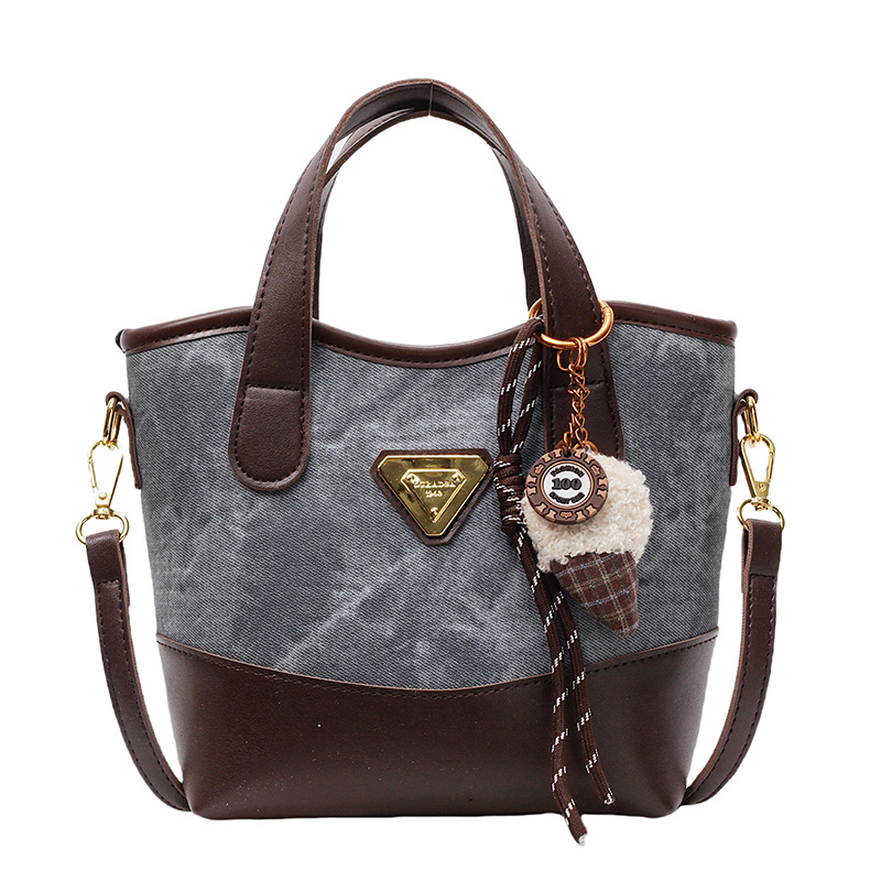 Bolso de mano de color de contraste de estilo explosivo de comercio exterior para mujer 2025 nuevo bolso de mensajero de moda salvaje bolso de cubo de ocio retro