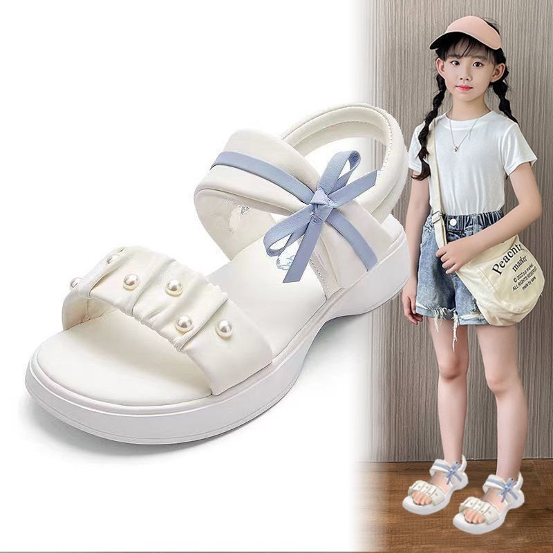 Zapatos de playa de moda de niñas versátiles 2026 verano nuevos zapatos de arco para niños Lefour zapatos de princesa huecos