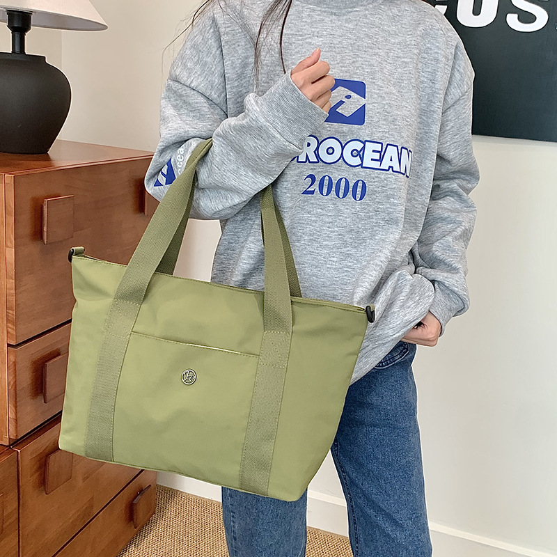 Primavera nueva bolsa de viaje impermeable de gran capacidad de alto valor, bolsa diagonal de un solo hombro para mamá de compras portátil de moda