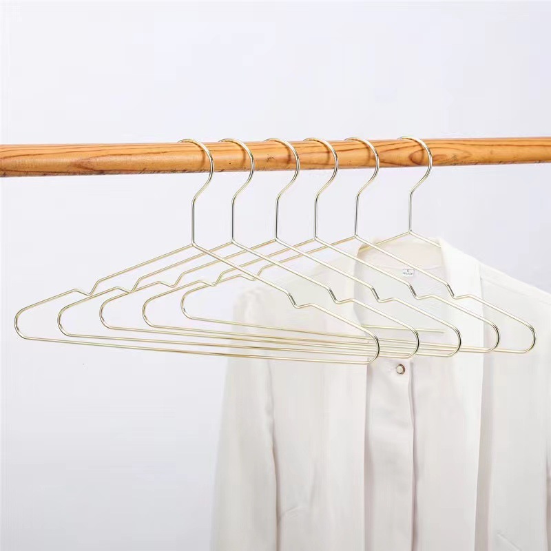 Estilo nórdico percha de ropa de metal antideslizante sin costuras percha de ropa de nueve hoyos galvanoplastia percha de ropa para el hogar percha de ropa de triángulo de oro rosa