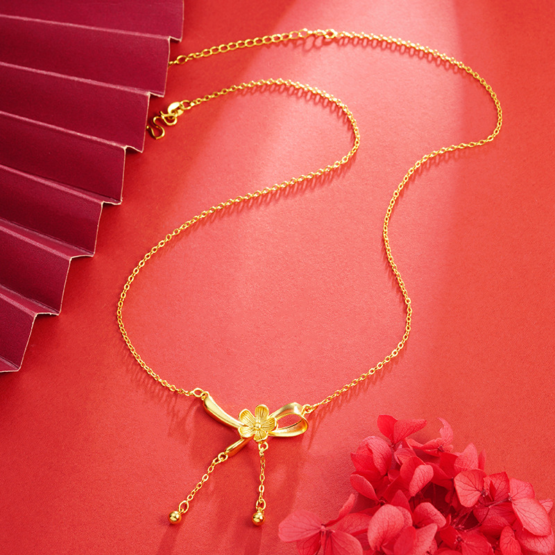 Oro flor arco collar cinta imitación oro borla joyería nicho Luz de lujo todo fósforo temperamento suministro al por mayor